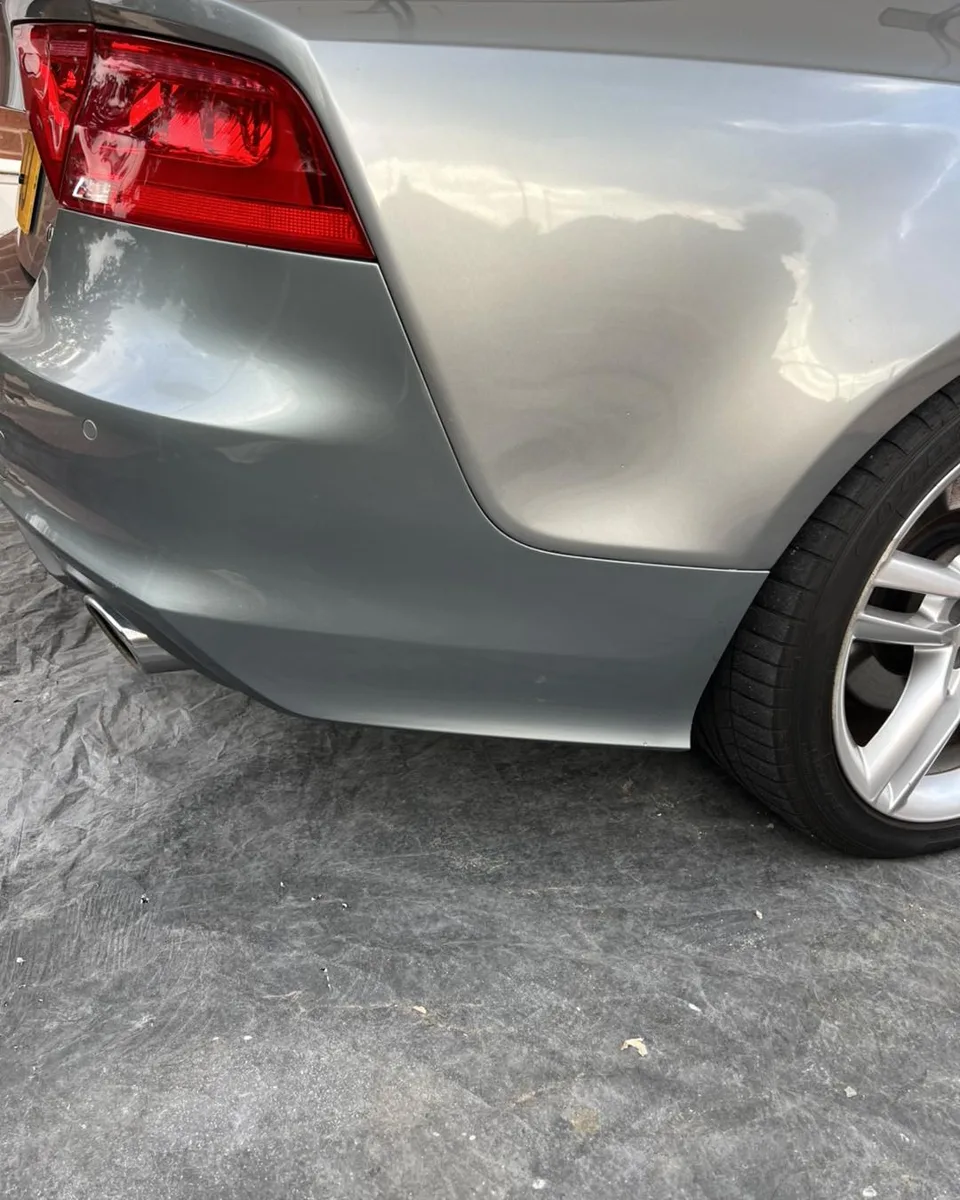 Finished silver rear bumper and quarter panel